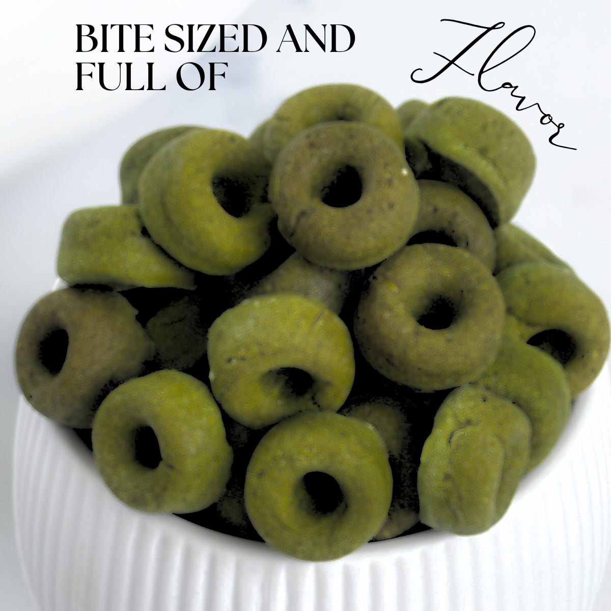 Superfood Spinach, Green Spirulina and Cottage Cheese Healthy Dog Treats in the shape of mini donuts. We call them Daisy Loops a playful color reference to Fruit Loops but for dogs.
